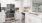 a kitchen with white cabinets