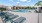 a swimming pool with lounge chairs