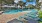 a pool with lounge chairs around it