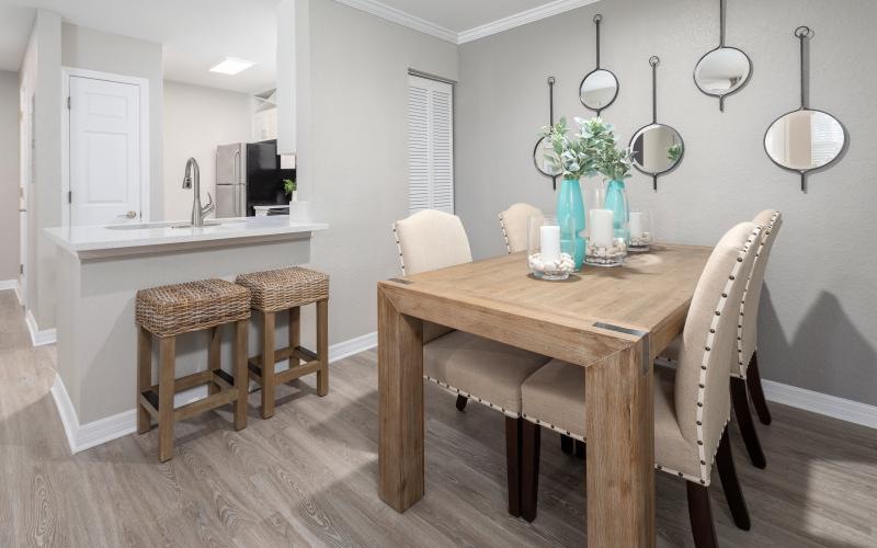 a kitchen with a table and chairs