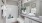 a bathroom with a tub sink and towels