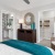 a bedroom with a bed and a chair