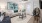 a living room with a couch and a fan