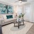 a living room with a couch and a fan